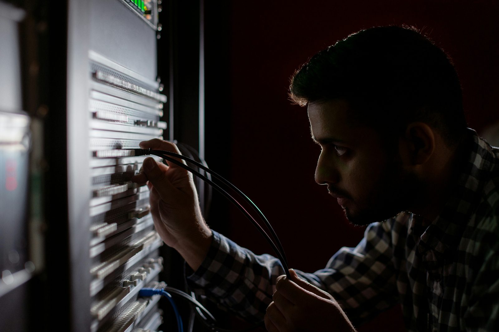Network technician configuring equipment