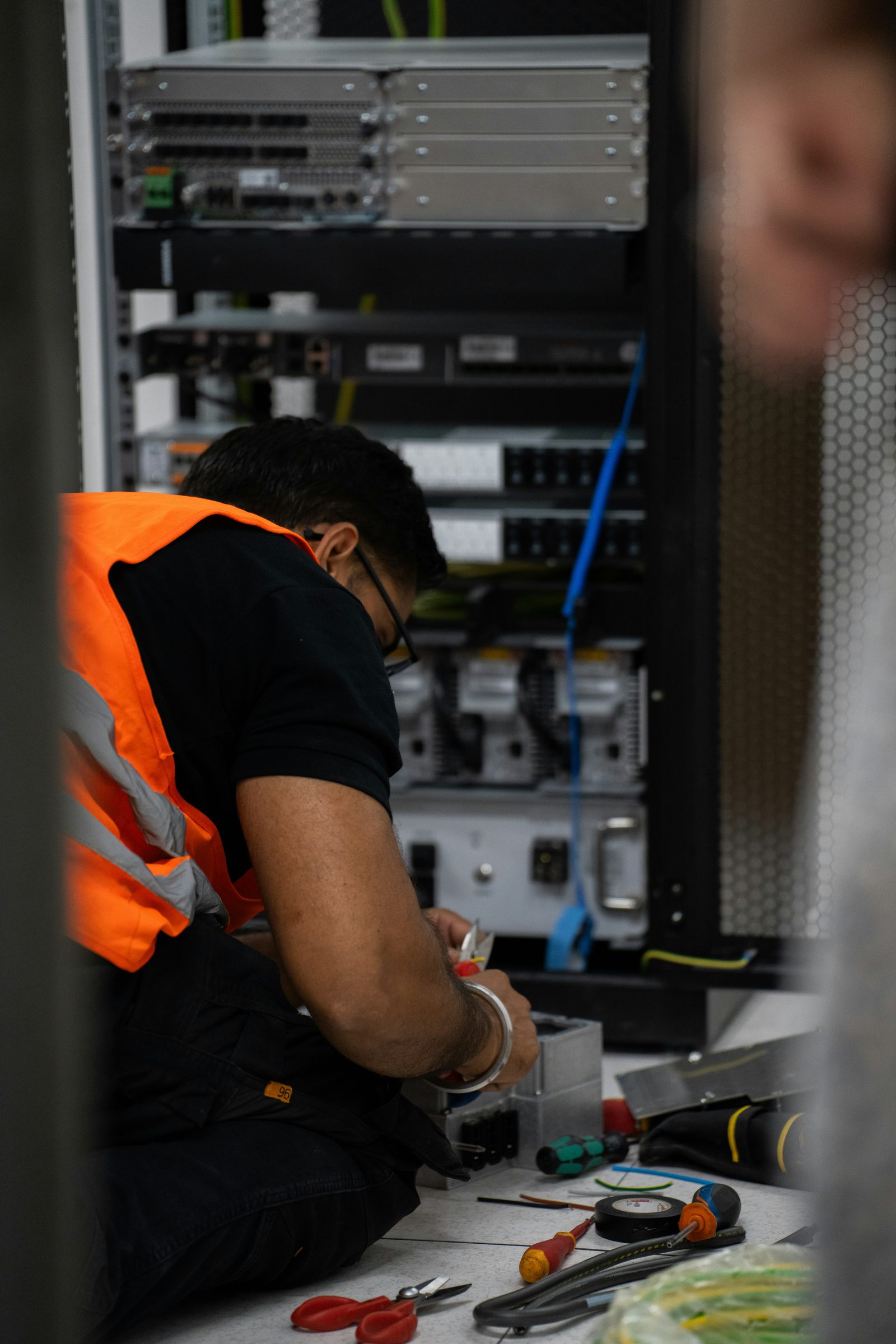 Technician servicing server equipment